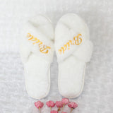 Bride and bridesmaid embroidered slippers in white with elegant gold lettering for wedding day comfort
