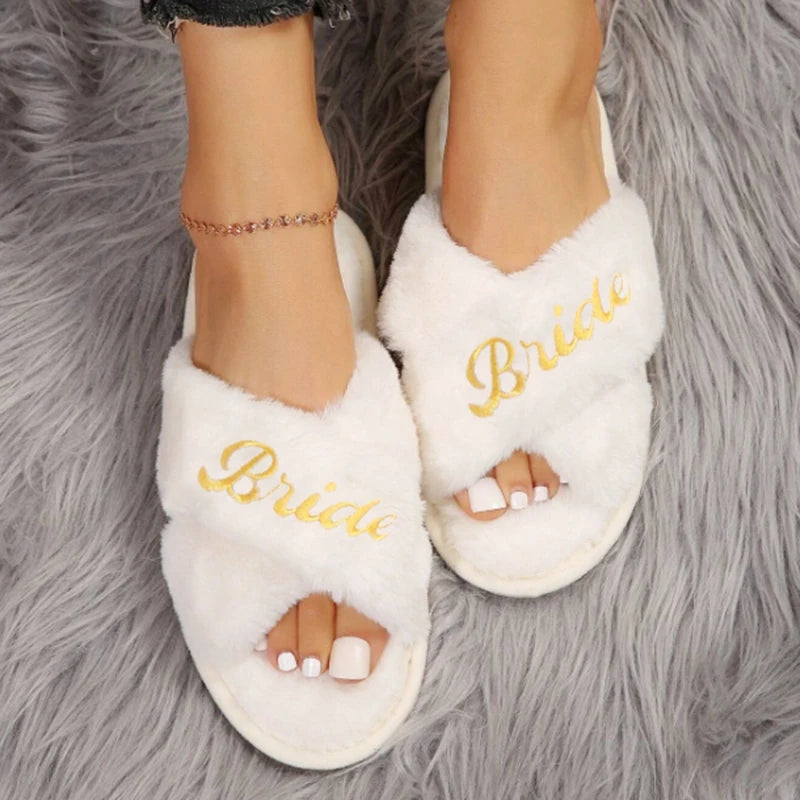 Bride and bridesmaid embroidered slippers in white with gold lettering for a stylish bridal party
