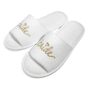 Elegant white bride and bridesmaid slippers for wedding featuring a gold embroidered 'Bride' design