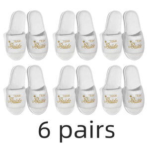 Six pairs of bride and bridesmaid slippers for wedding featuring gold lettering and comfortable design