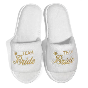 White bride and bridesmaid slippers for wedding with gold embroidery saying Team Bride
