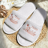 Soft white bride and bridesmaid slippers for wedding featuring TEAM Bride embroidery