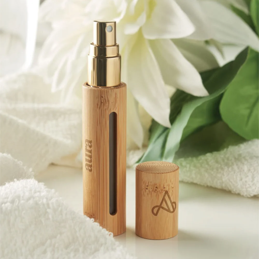 Custom bridesmaid perfume bottle in bamboo design with gold accents and eco-friendly materials