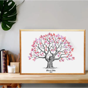 Fingerprint tree wedding guestbook with pink and purple leaves for guests to sign at weddings