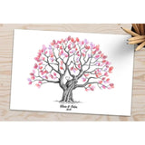 Fingerprint tree wedding guestbook featuring colorful leaves and personalized names and date