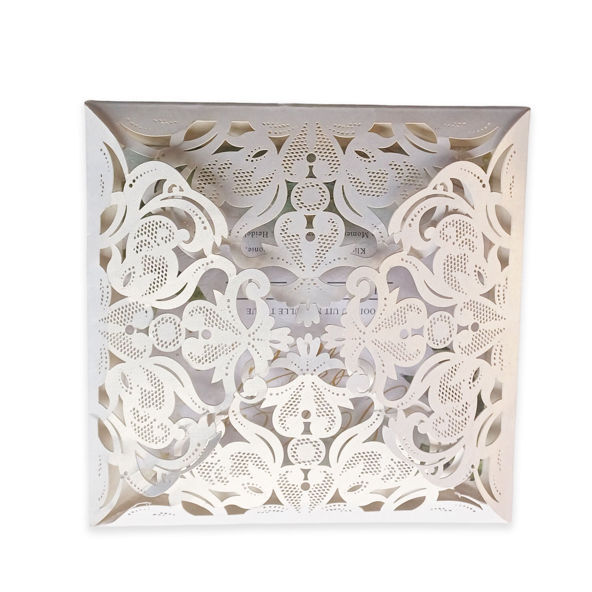 Elegant white fold-open cardstock invitations with intricate filigree floral design by Forevermore Momentos
