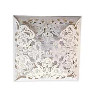 Elegant white fold-open cardstock invitations with intricate filigree floral design by Forevermore Momentos