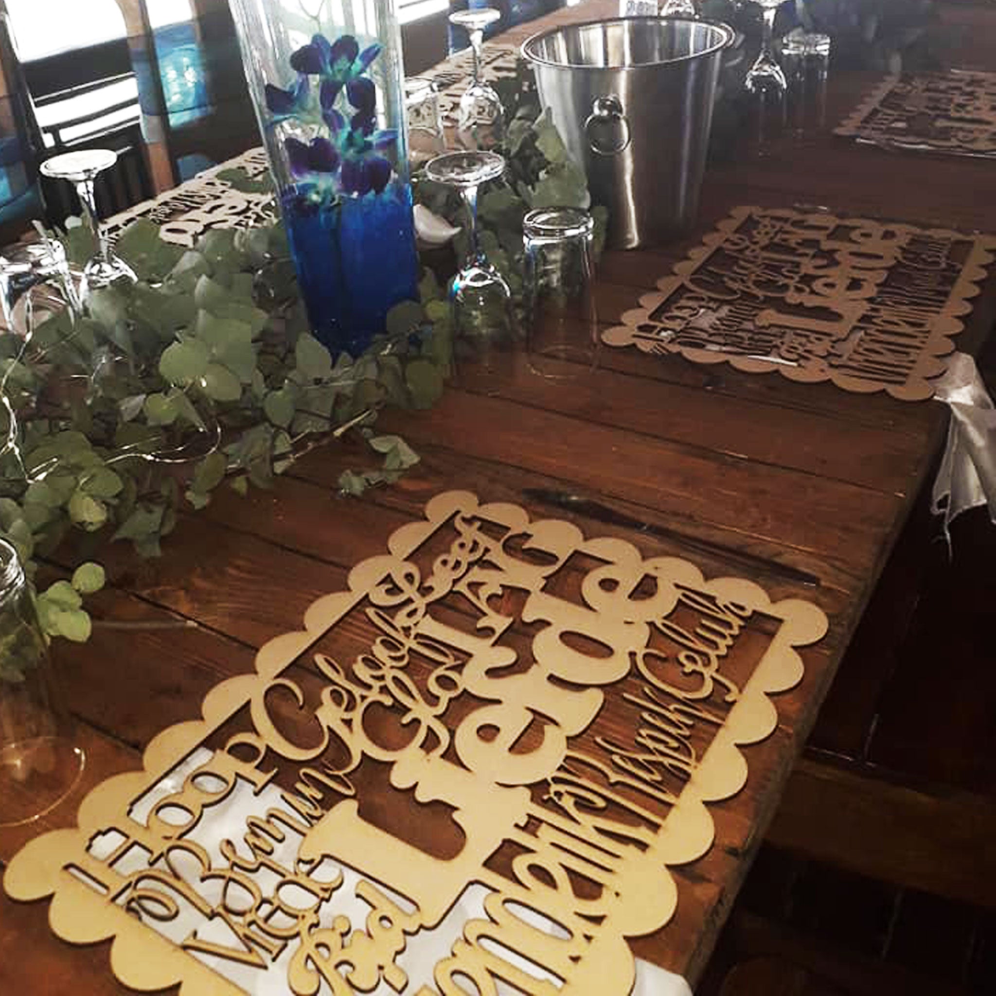 Forevermore Momentos laser-cut underplate keepsake with personalized names on wooden table centerpiece