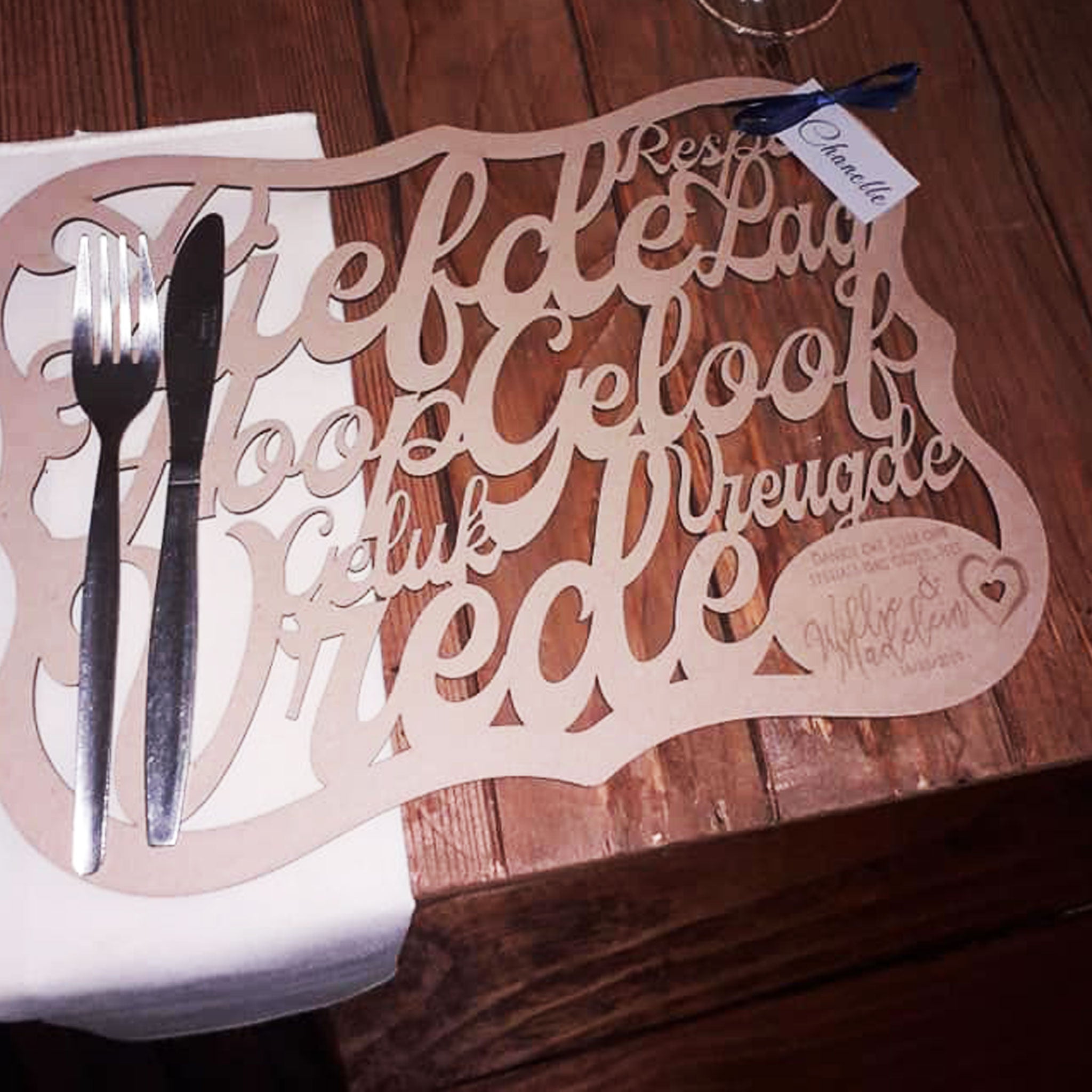 Forevermore Momentos laser-cut underplate keepsake with decorative script design on wooden table