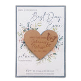 Laser-cut wooden heart magnet with save the date text and butterfly design on floral card