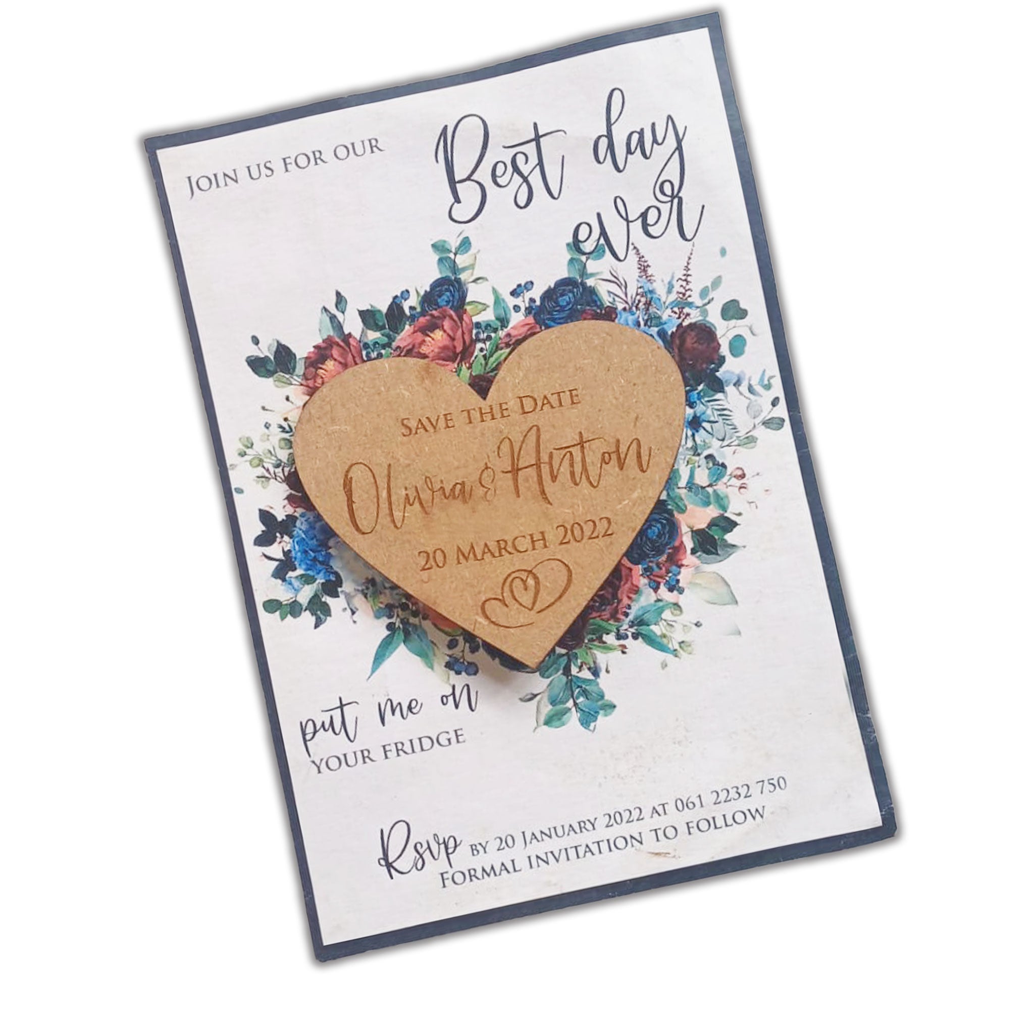 Laser-cut wooden heart magnet attached to floral save the date card with names Olivia and Anton