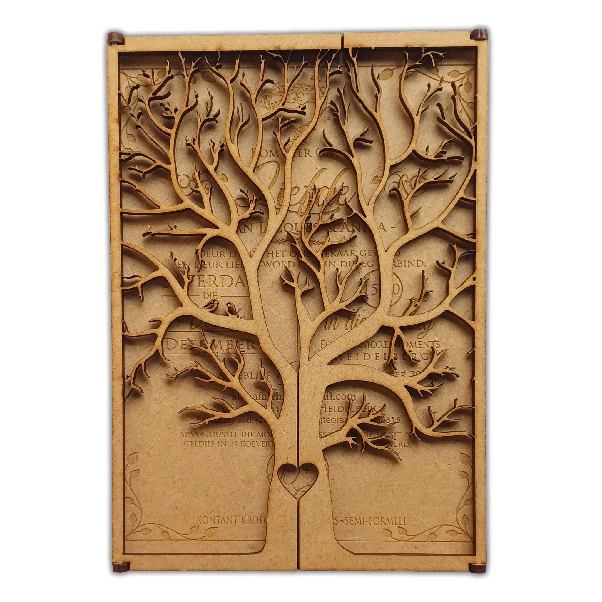 Intricate laser cut tree wedding invitation with detailed branches and heart design at the base