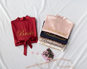 Personalized bridal party sleepwear set with bride and bridesmaid robes in various colors and elegant embroidery