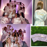 Group of women in personalized bridal party sleepwear with matching robes and accessories for a bridal celebration