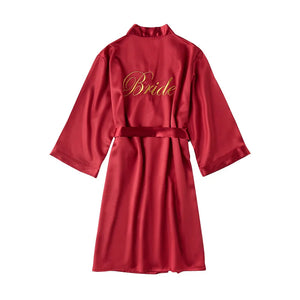 Personalized bridal party sleepwear in red satin with elegant 'Bride' embroidery on the back