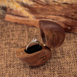 Personalized heart wood ring box with an elegant design, perfect for storing special rings.