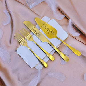 Personalized wedding cake cutting set with gold utensils featuring custom names on elegant plates