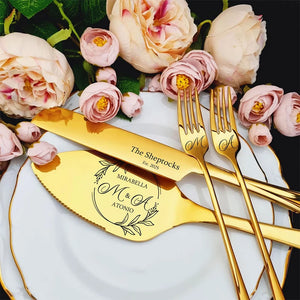 Elegant personalized wedding cake cutting set with gold utensils and floral accents for memorable celebrations