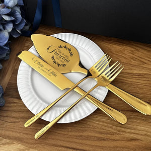 Personalized wedding cake cutting set featuring elegant gold utensils and customized names for newlyweds