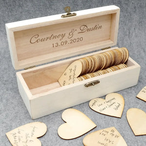 Personalized wooden wedding guest book with engraved names and date, featuring heart-shaped message cards