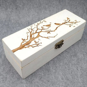 Personalized wooden wedding guest book with intricate tree design and birds, perfect for wedding memories