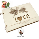 Rustic wood wedding guest book with a heart-shaped cutout and decorative bird design