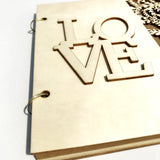 Rustic wood wedding guest book with laser-cut LOVE design for special memories