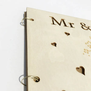 Rustic wood wedding guest book with engraved Mr and Mrs design and heart accents