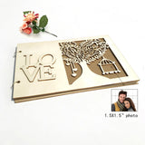 Rustic wood wedding guest book with decorative love and tree design for memorable sign-ins
