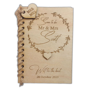 Unique book-style wedding invitations by Forevermore Momentos with rustic wooden cover and heart details