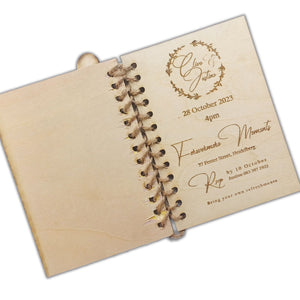 Unique book-style wedding invitations by Forevermore Momentos with rustic wooden cover and elegant engraved text