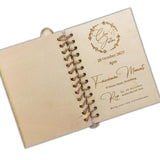 Unique book-style wedding invitations by Forevermore Momentos with rustic wooden cover and elegant engraved text