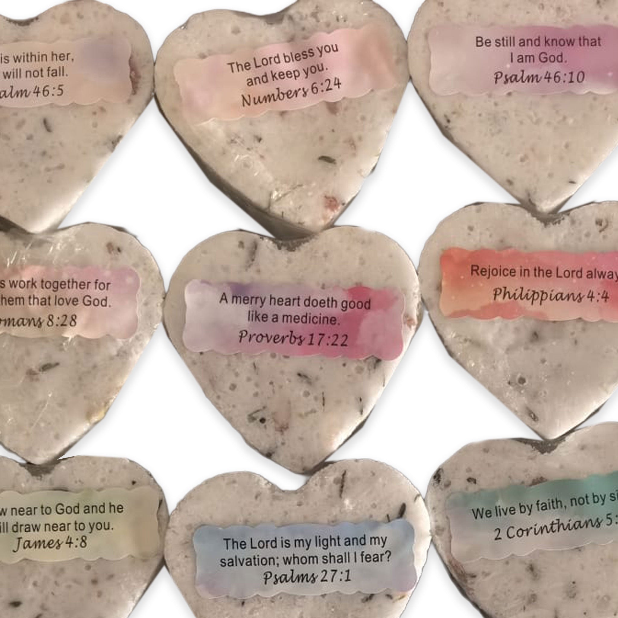 Heart-shaped wedding favor bath bombs with inspirational Bible verses in soft pastel colors