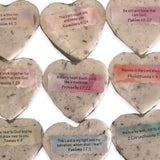 Heart-shaped wedding favor bath bombs with inspirational Bible verses in soft pastel colors
