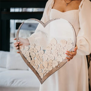 Beautiful wooden heart wedding guest book displayed with engraved wooden hearts for guests to sign
