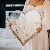 Beautiful wooden heart wedding guest book displayed with engraved wooden hearts for guests to sign