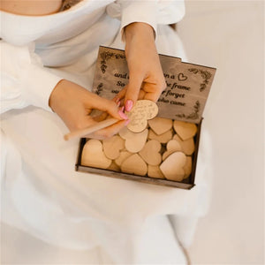 Wooden heart wedding guest book with heart-shaped cards for guests to leave messages at the wedding