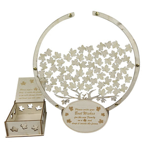 Wooden tree guest book alternative with leaf cutouts for collecting best wishes at events